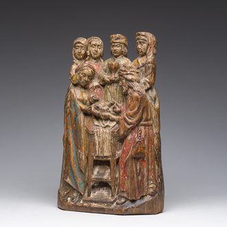 A carved and polychrome decorated wooden group depicting the circumcision of Jesus, 19th C.