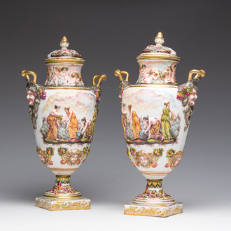 A pair of Italian polychrome and gilt Capodimonte porcelain vases and covers with relief design after the antique, late 19th C.