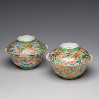 A pair of Chinese Canton famille rose 'dragons chasing the pearl' bowls and covers, 19th C.