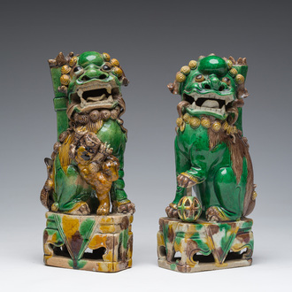 A pair of Chinese sancai glazed biscuit Buddhist lion joss-stick holders, 19th C.