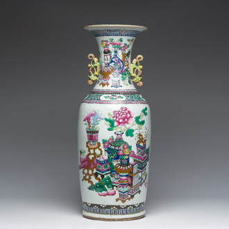 A Chinese famille rose and iron-red vase with a double design of antiquities and Buddhist lions, 19th C.