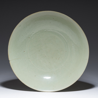 A Chinese Longquan celadon dish with incised floral design, Ming