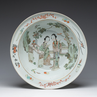 A large Chinese qianjiang cai bowl with ladies relaxing in a palace garden, 19th C.