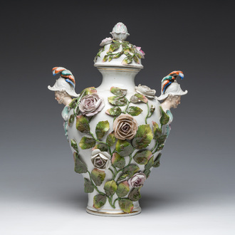 A German polychrome decorated Saxon porcelain vase and cover with elaborate relief design, Sitzendorf mark, ca. 1900