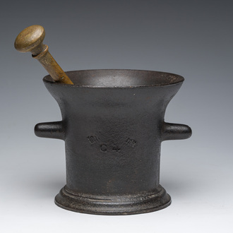 A large cast-iron mortar with inscriptions and pestle, presumably Liège or Germany, 19th C.