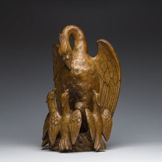 A Belgian patinated terracotta group with a pelican feeding her young as a symbol of parental love and self-sacrifice, 19th/20th C.
