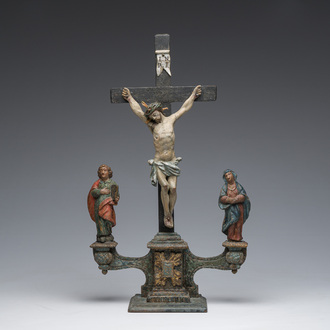 A Spanish polychrome decorated wooden crucifixion group with Jesus on the cross flanked by Mary and John the Evangelist, 18th C.