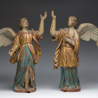 A pair of Italian gilt and polychrome decorated wooden angels, late 18th C.