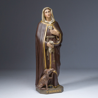 A polychrome decorated plaster figure of Saint Margaret with her dog, 19th/20th C.