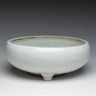 A Chinese monochrome white tripod censer with underglaze design, 19th C.