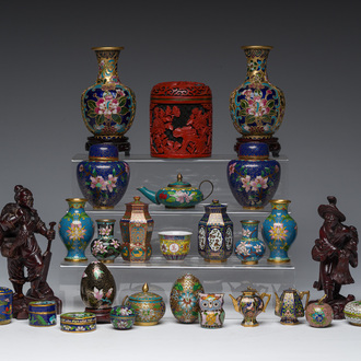 A varied collection of Chinese cloisonné vases and boxes, two wooden figures and a carved cinnabar and black lacquer box and cover, 20th C.