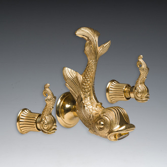 An Italian gilt bronze dolphin-shaped tap and two associated tap buckles, 20th C.