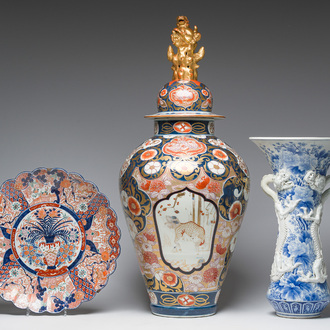 A Japanese blue and white Hirado vase with dragon relief design, an Imari vase and cover and a dish with floral design, Meiji, 19th/20th C.