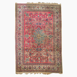 A Persian Isfahan rug with floral design, wool on cotton, 20th C.