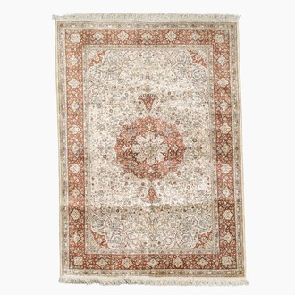 A Turkish silk Hereke rug with floral design, 20th C.