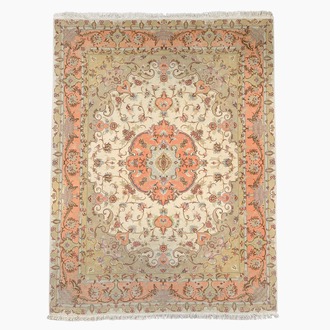 A Persian Tabriz rug with floral design, wool, cotton and silk, 20th C.