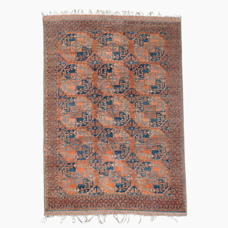 An Afghan rug with geometric design, wool on cotton, 20th C.