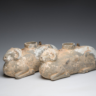 A pair of Chinese polychrome painted pottery ram-shaped vessels, Han dynasty