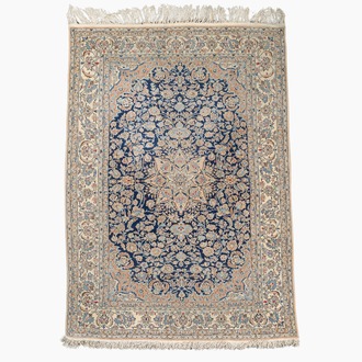 A Persian Nain rug with floral design, wool on cotton, 20th C.