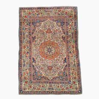 A Persian Isfahan rug with floral design, wool on cotton, 20th C.