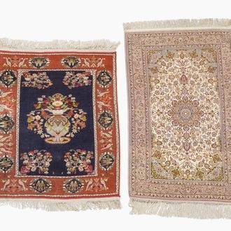 A Persian Isfahan rug and a Turkmen rug with floral design, wool, cotton and silk, 20th C.