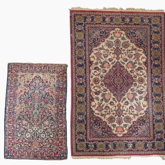 Two Persian rugs with floral design, Kashan and Kerman (Kirman), wool on cotton, 20th C.