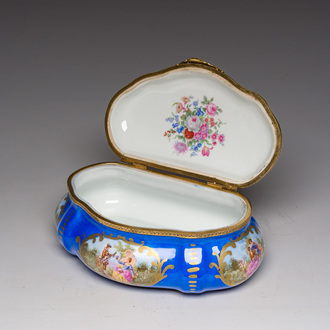 A French gilt and polychrome decorated jewelry box with amorous scenes and floral design, Sèvres mark, 19th/20th C.