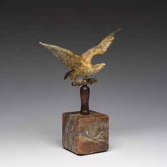 A Viennese polychrome cold painted bronze model of an eagle on a wooden and onyx marble base, 19th/20th C.