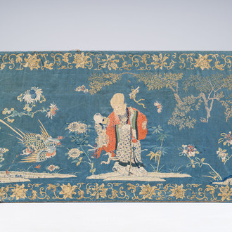 A Chinese horizontal silk embroidery with the 'Star God' Shou Xing and his servant in a landscape, 19th C.