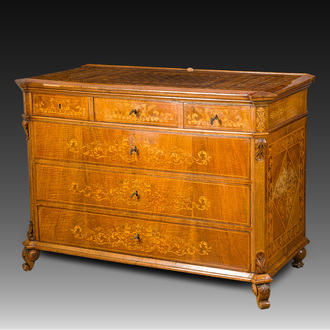 A North Italian commode with four drawers in mahogany and walnut with inlay of sphinxes and flowers in lemonwood, first third 19th C.