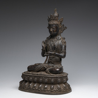 A Sino-Tibetan patinated bronze figure of Buddha, 20th C.
