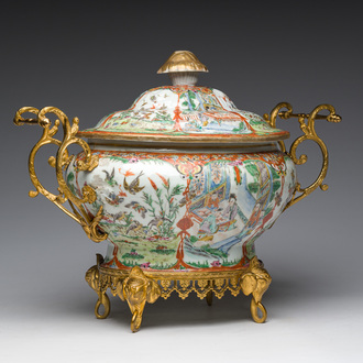 A Chinese Canton famille rose gilt mounted tureen and cover with animated scenes resting on four elephant heads, 19th C.