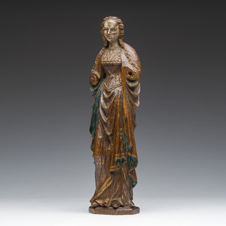 A Flemish carved, polychrome decorated and gilt oak sculpture of a female saint or 'Poupée de Malines', 16th C.