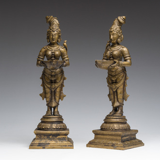 A pair of Indian oil lamps in the shape of Deepalakshmi with a bowl in her hands, 20th C.