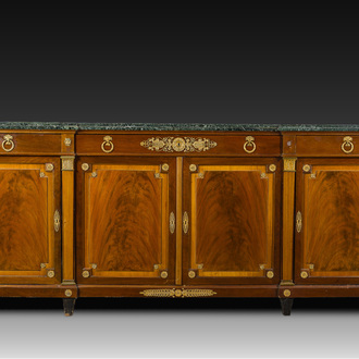 An imposing French Empire style gilt bronze mounted cherrywood dresser with a green marble top, 20th C.