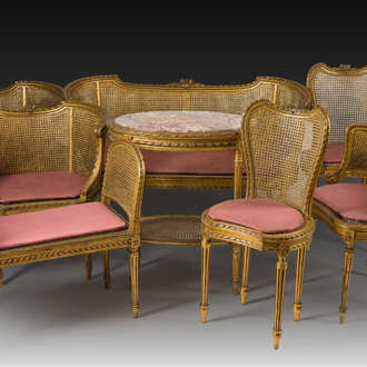 A French Louis XVI style eight-piece carved and gilt wooden salon set, 19th/20th C.
