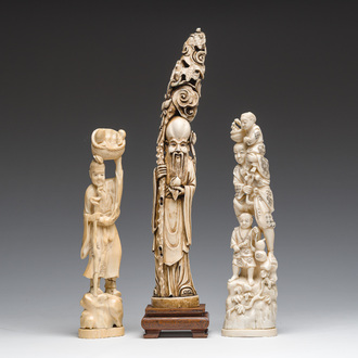 A Chinese carved ivory 'Shou Lao' figure and two walrus ivory groups depicting the local population, 19th/20th C.