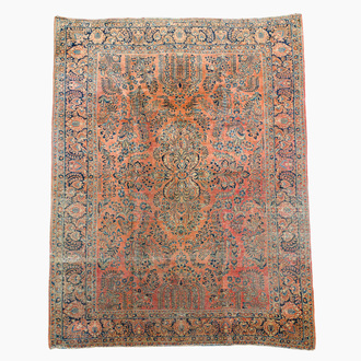 A Persian American Sarouk rug with floral design, wool on cotton, 20th C.