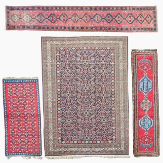 Four oriental rugs, a.o. a Persian Shirvan rug and an Azerbaijani runner with geometric design, wool on cotton, 20th C.