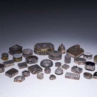 A varied collection of 33 pill boxes in silver and (silver-plated) metal finished with mother-of-pearl, turquoise, etc., various origins, 20th C.