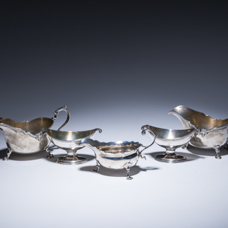 Three English silver sauce boats and a pair of 'armorial' salt cellars, 18th/20th C.