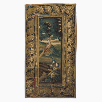A Flemish wall tapestry with a pheasant in a landscape, 17th C.