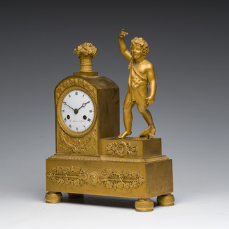A Ghent gilt bronze mantel clock crowned with a male Bacchante, 19th C.
