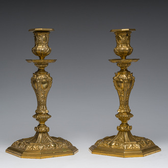 A pair of French gilt bronze Régence style candlesticks with floral design, late 19th C.