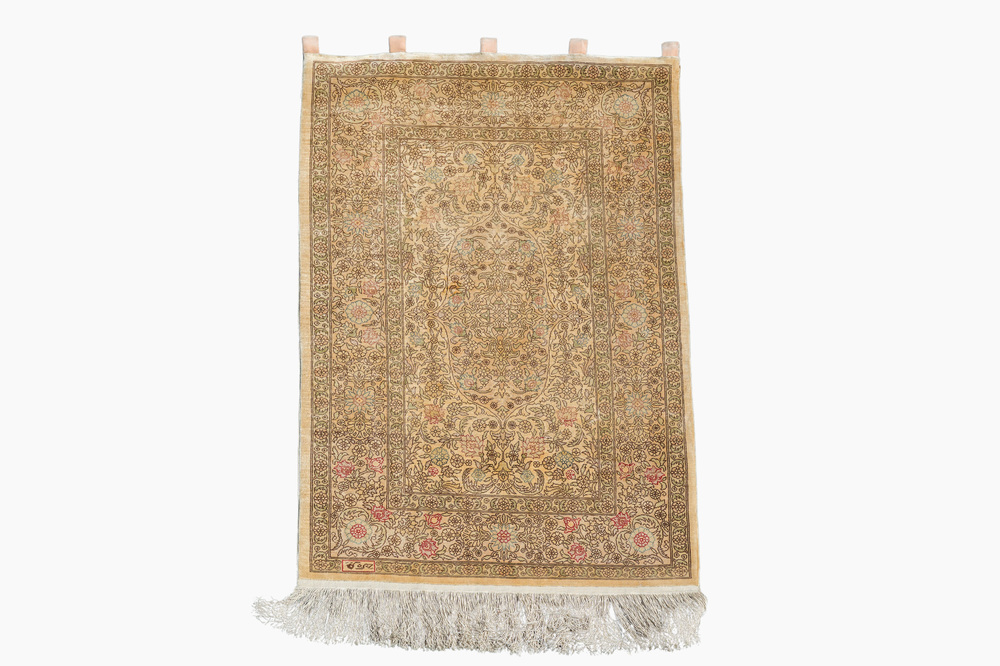 A Turkish silk Hereke rug with floral design, 20th C.