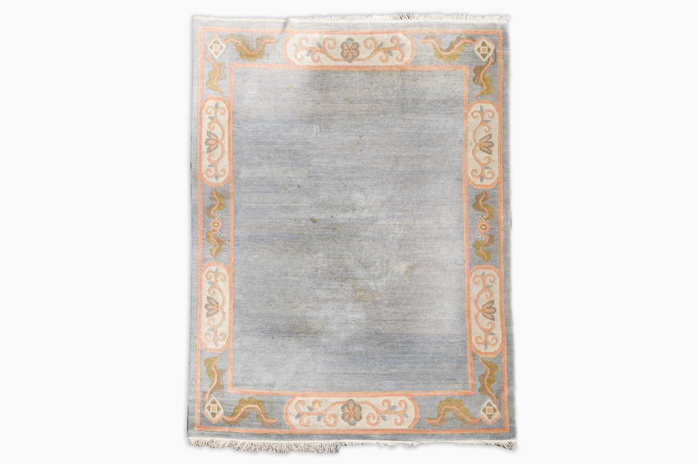 A Nepalese wool Kangri rug with floral design, 20th C.