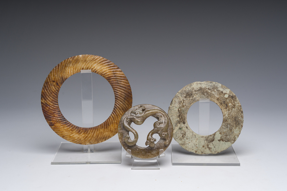 Three jade and/or hardstone discs or bracelets, China and Thailand, probably Jin Dynasty and later