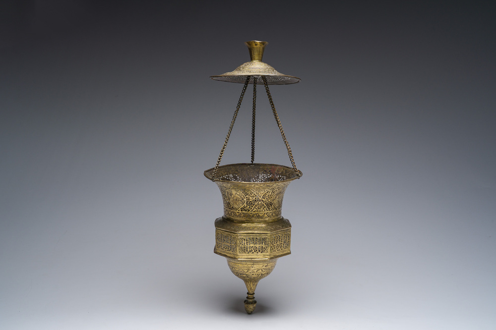 An engraved and reticulated brass Mamluk style hanging lantern, Egypt or Syria, 19th C.