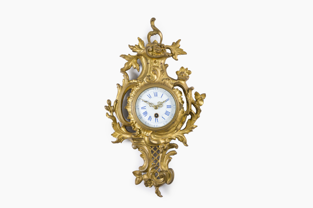 A French gilt bronze Louis XV style cartel clock with floral design, 19th/20th C.
