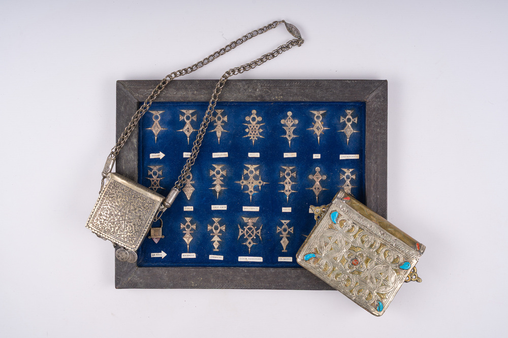 21 silver Tuareg pendants and two Koran boxes in silver and copper, Nigeria, Mali and Morocco, 19th/20th C.